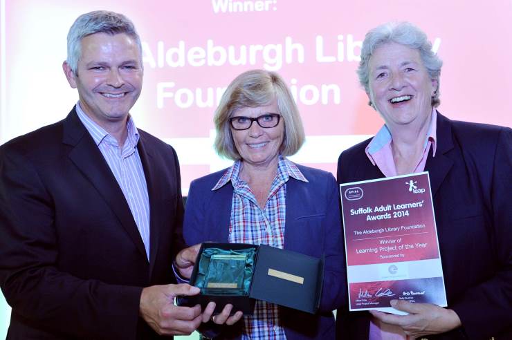 Simon Mead from the Eastern Enterprise Hub presents Anne Parsons (middle) and Lynne Walker (right) from the Aldeburgh Foundation with their award