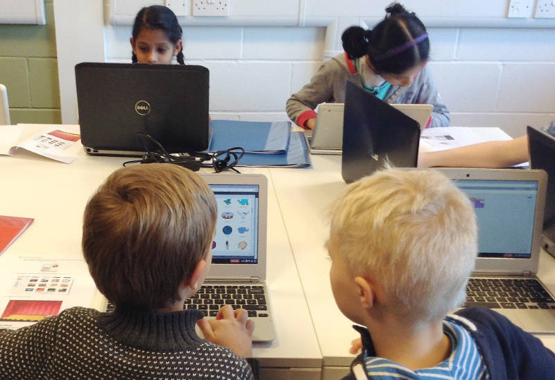 Children working on laptops