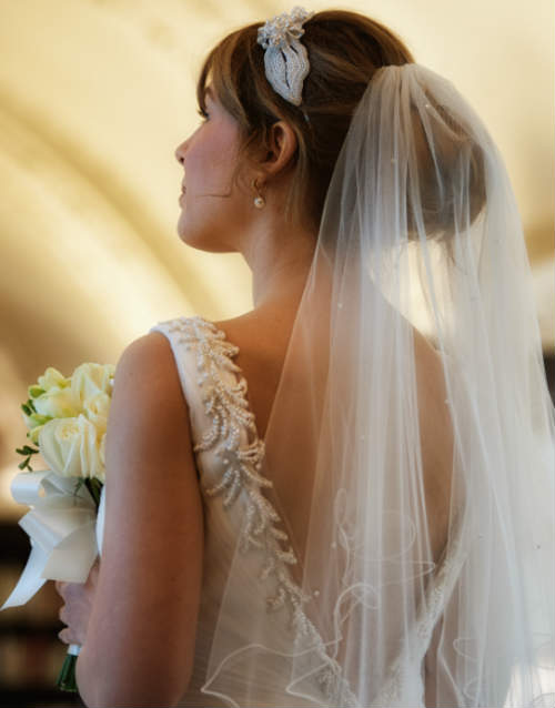 A woman in a wedding dress in the library