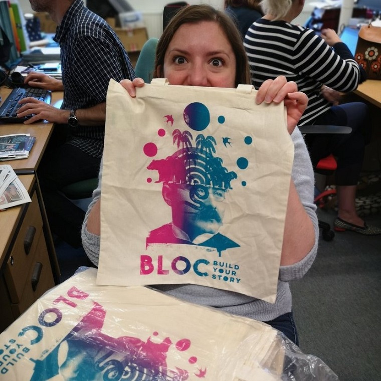 Woman displaying BLOC bag