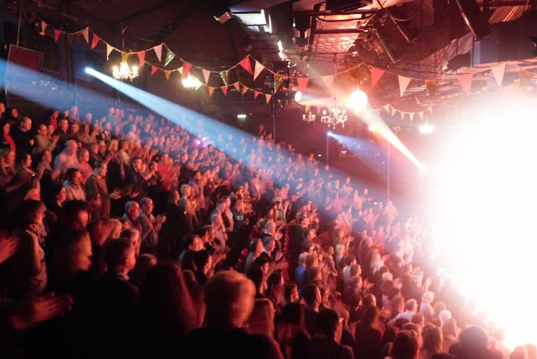 People watching a theatre event.