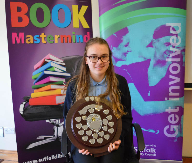 Katy Shaw with the Book Mastermind trophy