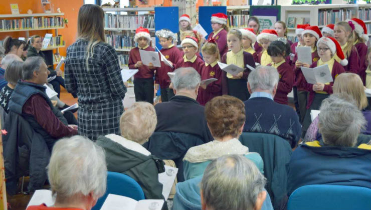 Schoolchildren sing carols to elderly people at Chantry Library