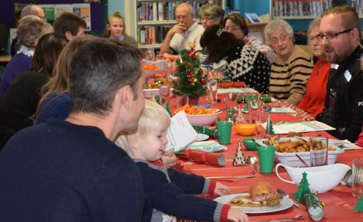 Members of the community enjoy a Christmas meal at Chantry Library