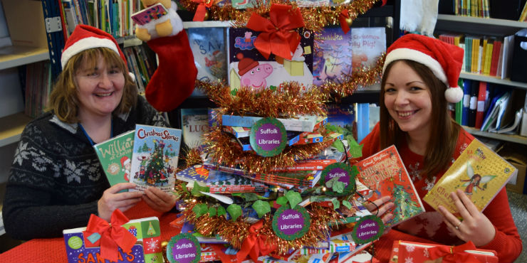 Staff members Kate Bacon and Sherryl Goldsmith with our festive books