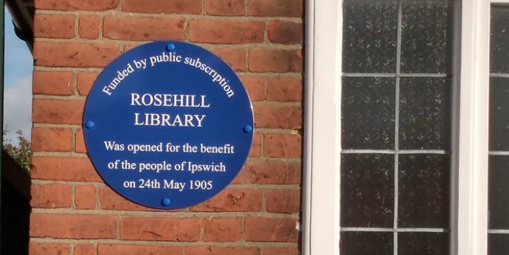 The blue plaque on the wall at Rosehill Library