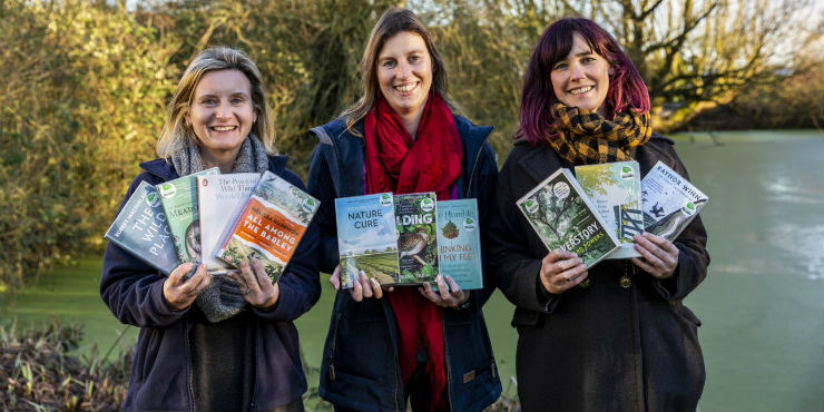 Sara Holman from Suffolk Wildlife Trust and Kellie Dimmock and Sophie Green from Suffolk Libraries holding the Wild Reads book collection