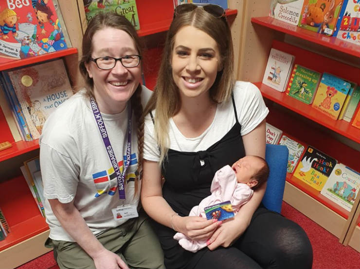 Baby Summer with mum Lucy Gildroy and Lowestoft Library staff member Debs Pullum